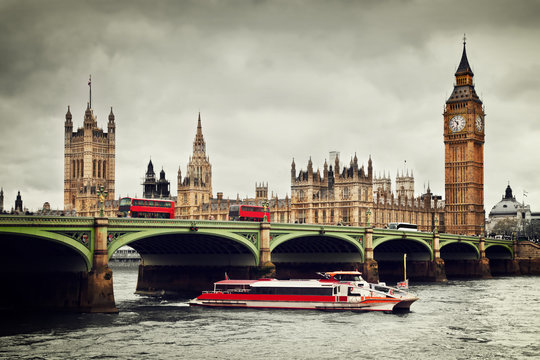 London, The UK. Big Ben, The River Thames, Red Buses And Boat