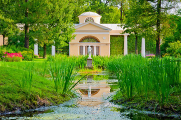 beautiful building and the statue in the park of St. Petersburg