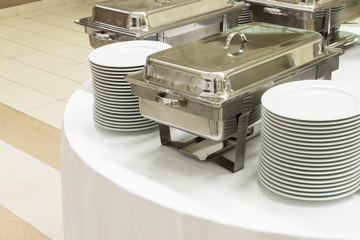 metal kitchen equipments on the table for fine wedding dining