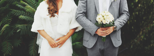 Young wedding couple outdoor. Groom and bride together.