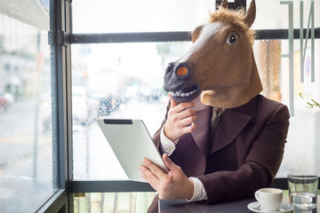 young stylish man lifestyle horse mask