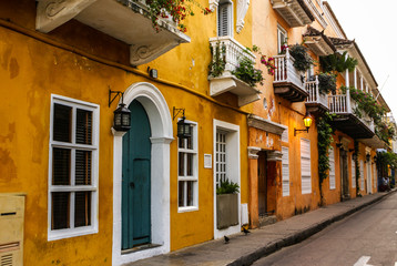 Fototapeta na wymiar Typical street scene in Cartagena, Colombia of a street with old