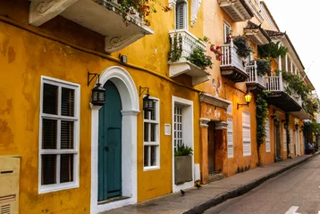 Fotobehang Typical street scene in Cartagena, Colombia of a street with old © Lukasz Janyst
