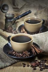 Two cups of coffee with spices and old cezve