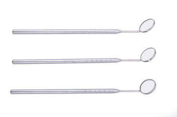 Dental mirrors on white background