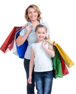 mother and young daughter with shopping bags