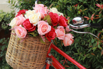 beautiful of rose artificial flowers in vintage bicycle