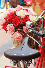 beautiful of rose artificial flowers in vintage bicycle