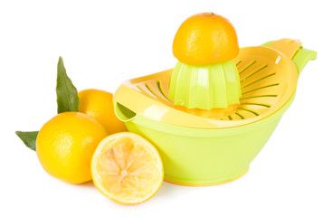 Citrus press and lemons isolated on white