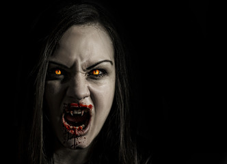 Bloodthirsty female vampire with angry expression - obrazy, fototapety, plakaty