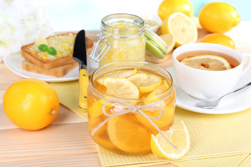 Tasty lemon jam on table close-up