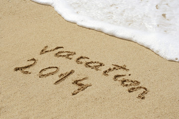 Conceptual text sand on beach
