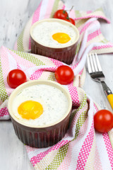 Baked eggs on table close up