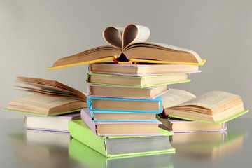Fototapeta premium Stacks of books on grey background
