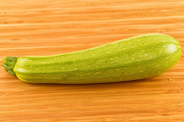 zucchini isolated on wooden background