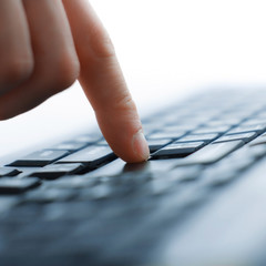 Close-up of typing male hands on keyboard