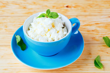 cottage cheese in the blue cup
