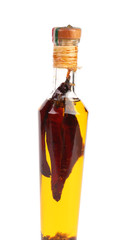 Red chillies preserved in bottle of oil.