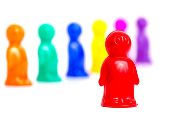 Colorful toy people group on white