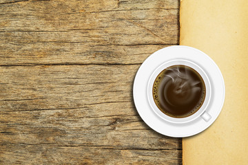 Coffee on old paper on the wood background