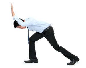 Fototapeta premium Young businessman pushing a blank board