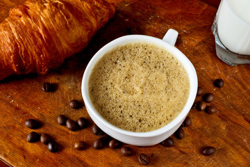 Coffee, croissant and milk