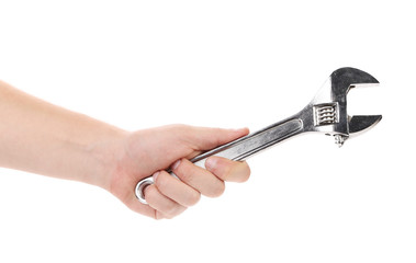 Man hand holds wrench.