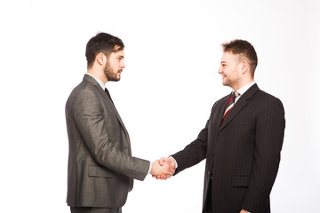 shaking hands of two businessmen