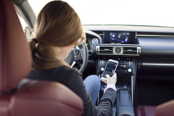 Young woman typing text message