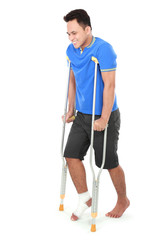 male with broken foot using crutch