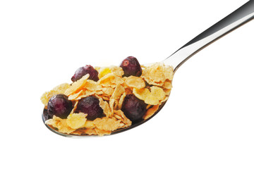 Cornflakes with fruits on the spoon
