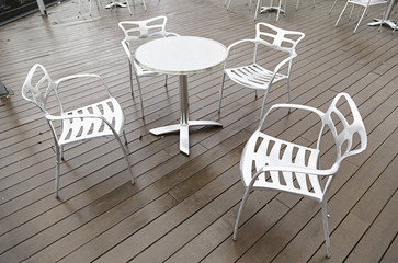 Metal chairs and table on a terrace