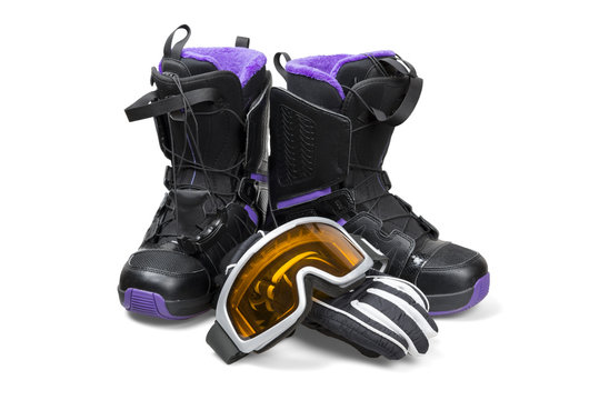 Snowboard boots with gloves and goggles - clipping path.