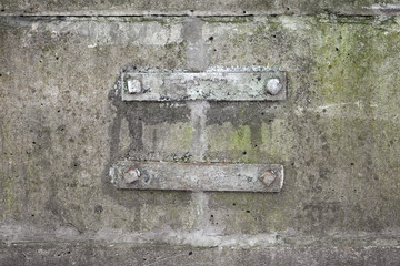 Rusted bracket steel details on old concrete wall