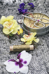 sewing tools and floral decorations