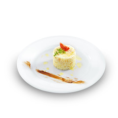 Health vegetarian rice with tomato and butter on a round plate i