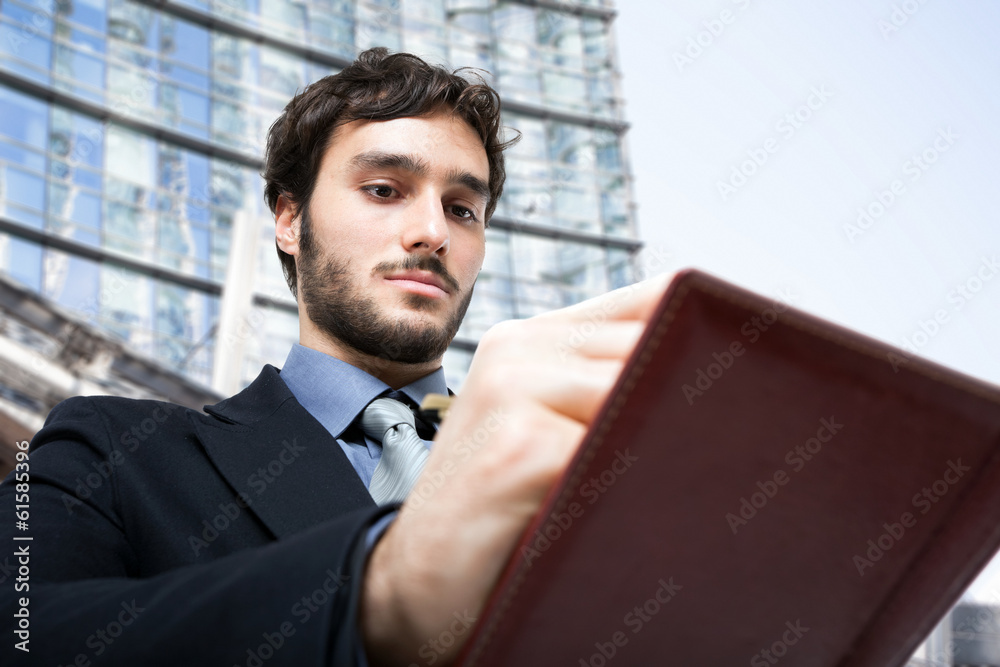 Poster Businessman writing notes