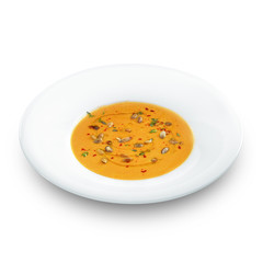 Hot healthy vegetarian pampkin cream soup with pampkin seeds in