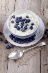 rice pudding and blueberries in a bowl
