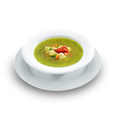Hot vegetarian healthy soup with pesto sauce, noodles and vegeta