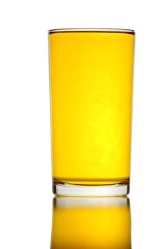 Glass of yellow water isolated.