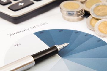 Business diagram on financial report with coins