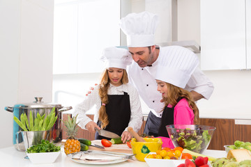 Chef master and junior pupil kid girls at cooking school