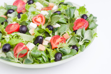 Fototapeta na wymiar Fresh salad on wooden background