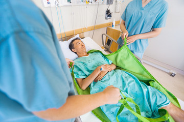 Nurses Preparing Mature Patient Before Transferring Him On Hydra