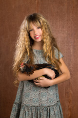 children fashion farmer girl holding hen retro vintage