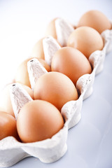 the brown eggs in egg box