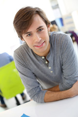 Portrait of smiling student in school class