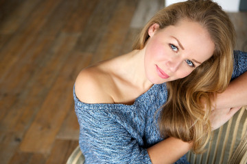 Elegant young woman relaxing at home