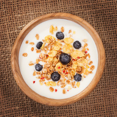 Muesli with yogurt and fresh blueberries. Top view